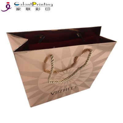 Custom luxury glossy gold foiling gift bags wholesale decorative paper bag shopping