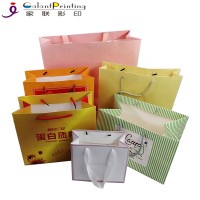 Wholesale Customized Brand Printed White Khaki Carrier Gift Paper Bag with Ribbon Handle for Tea Clothes Package